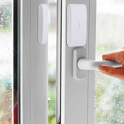 Hand opening window with door sensor attached.